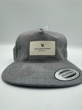 Vuori Gray Five-Panel Adjustable Cap/ Front Patch with faint camo design on brim